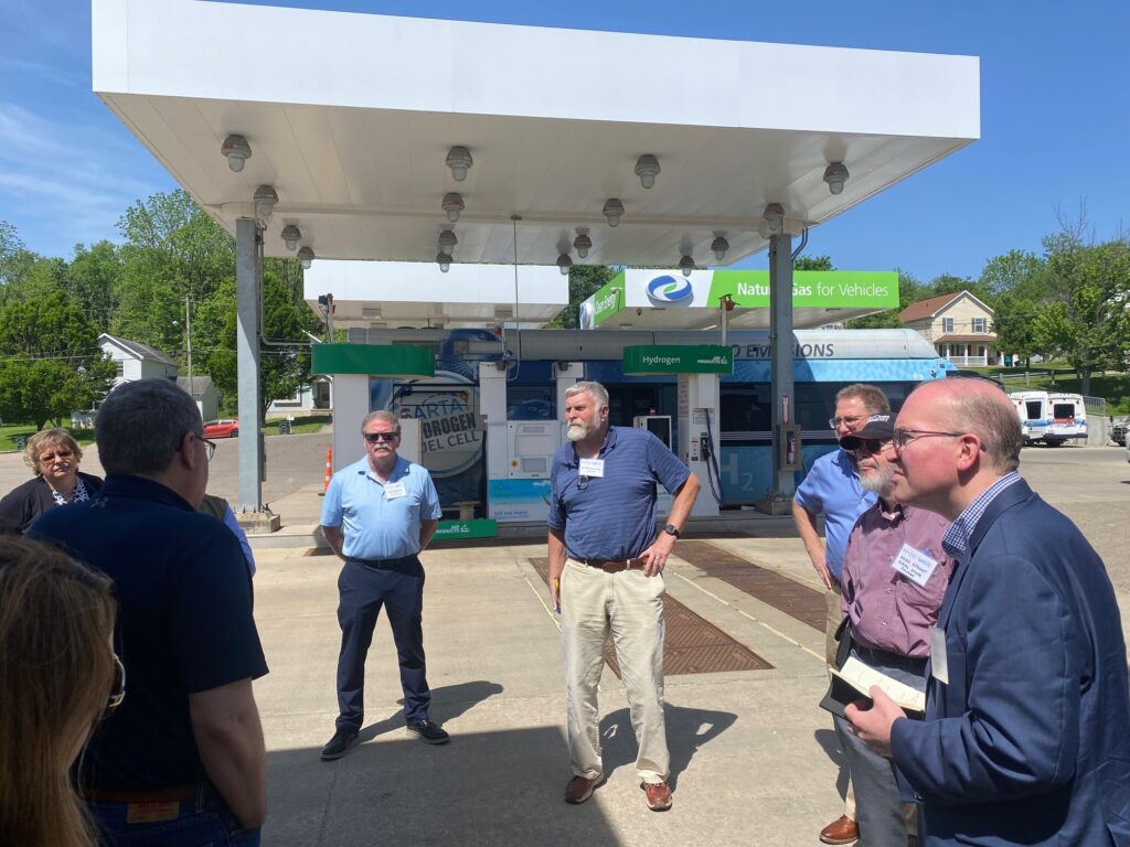 Group with bus and fueling station